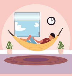 Young Man Lying On Hammock In Room