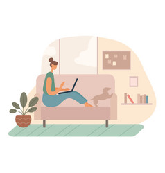 Female Freelancer Using Laptop On Couch Near Dog