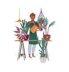 Young Man Watering Home Plants With Watering Can