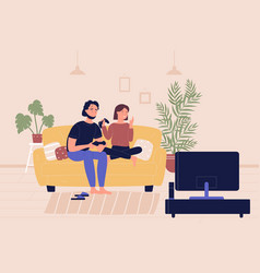 Young Family Couple Sitting On Sofa Playing On Tv