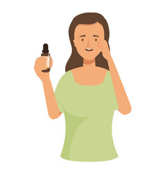 Young Woman Applying Essential Oil On Her Face