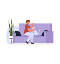 Man Sitting On Sofa Of Home Living Room With Cat