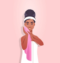 African American Woman Cleaning Face With Pink