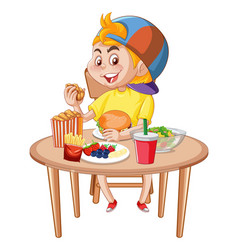 A Boy Having Meal At The Table