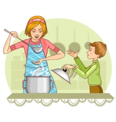 Mother And Son Tests Food In The Kitchen