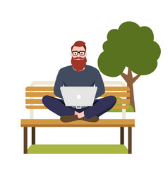 Freelancer Man Sitting On A Bench With A Laptop