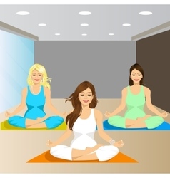 Three Smiling Women Sitting In Yoga Pose