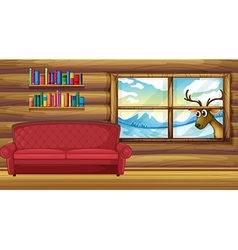 An Empty Sofa With Bookshelves At The Back