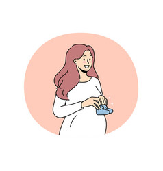 Smiling Pregnant Woman With Baby Shoes