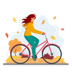 Woman Riding Bicycle In Autumn Park