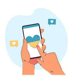 Hand Holding Phone With Heart In Blue And Yellow