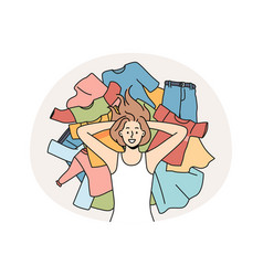 Smiling Woman Lying On Pile Of Clothes