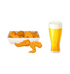 Glass Of Foam Light Beer And Fried Chicken Wings