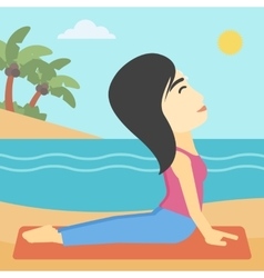 Woman Practicing Yoga Upward Dog Pose On Beach