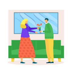 Man Giving Flowers To Woman In Living Room