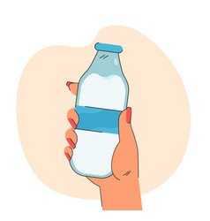 Hand Holding Glass Bottle Of Milk