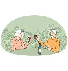 Elderly Couple Drinking Wine In Restaurant