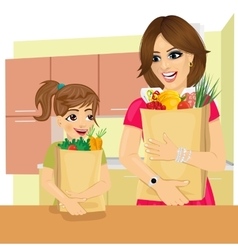 Daughter And Mother With Groceries Paper Bags