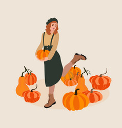 Young Woman Picking Pumpkins At Autumn Garden