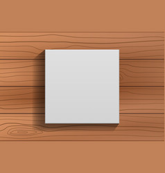 White Blank Canvas Frame On Brown Wooden Wall