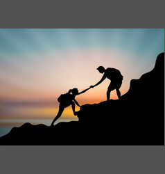 A Couple Of Hikers Helping Each Other Climb