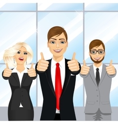 Businessmen Showing Thumbs Up In An Office