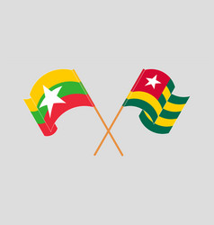 Crossed And Waving Flags Of Myanmar And Togo