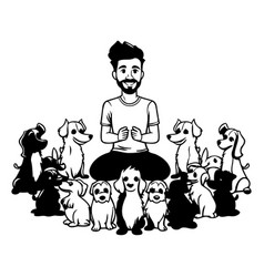 A Man Sitting In Front Of A Group Of Dogs