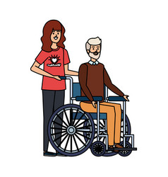 Young Woman Volunteer With Old Man In Wheelchair