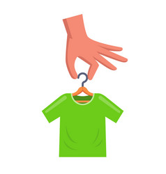 Man Is Holding A Hanger With A Green T-shirt