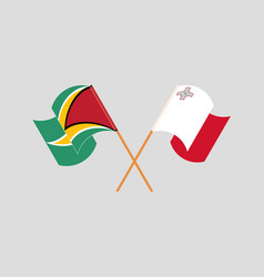 Crossed And Waving Flags Of Guyana And Malta