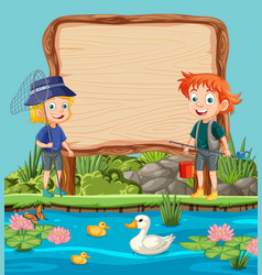 Two Kids Fishing Near A Pond With Blank Sign