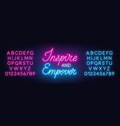 Inspire And Empower Neon Sign On Brick Wall