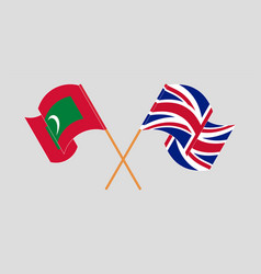 Crossed And Waving Flags Of Maldives And The Uk