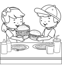 Children At A Restaurant Eating Hamburgers