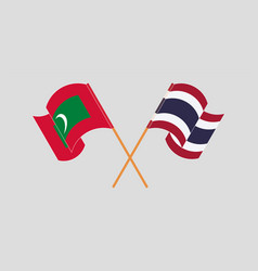 Crossed And Waving Flags Of Maldives And Thailand