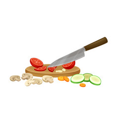 Knife Chopping Vegetables On Cutting Board