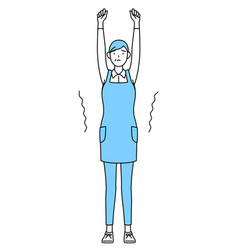 A Senior Woman In An Apron Stretching And