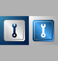 White Wrench Spanner Icon Isolated On Blue