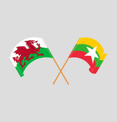 Crossed And Waving Flags Of Wales And Myanmar