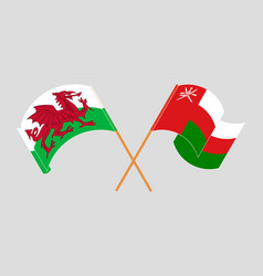 Crossed And Waving Flags Of Wales And Oman