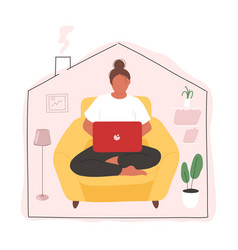 Woman Sitting In Armchair With Laptop On Her Lap