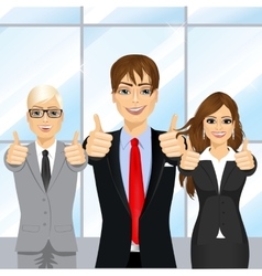 Businessmen Showing Thumbs Up In An Office