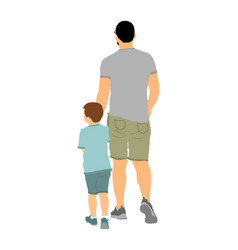 Young Father And Son Holding Hands Walking