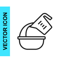 Black Line Measuring Cup Pouring Liquid Into Bowl