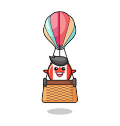 Canada Flag Mascot Riding A Hot Air Balloon