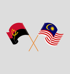 Crossed And Waving Flags Of Angola And Malaysia