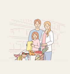 Happy Family In Supermarket With Basket Full