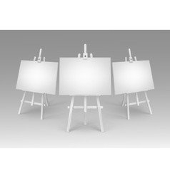 White Wooden Easels With Empty Blank Canvases