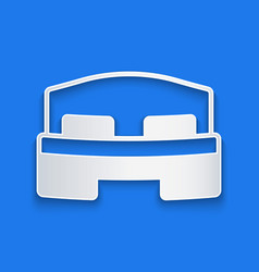 Paper Cut Hotel Room Bed Icon Isolated On Blue